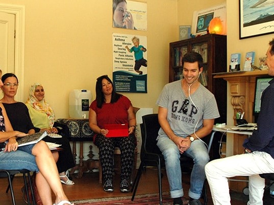 Nicky teaching a small group during a breathing retraining course